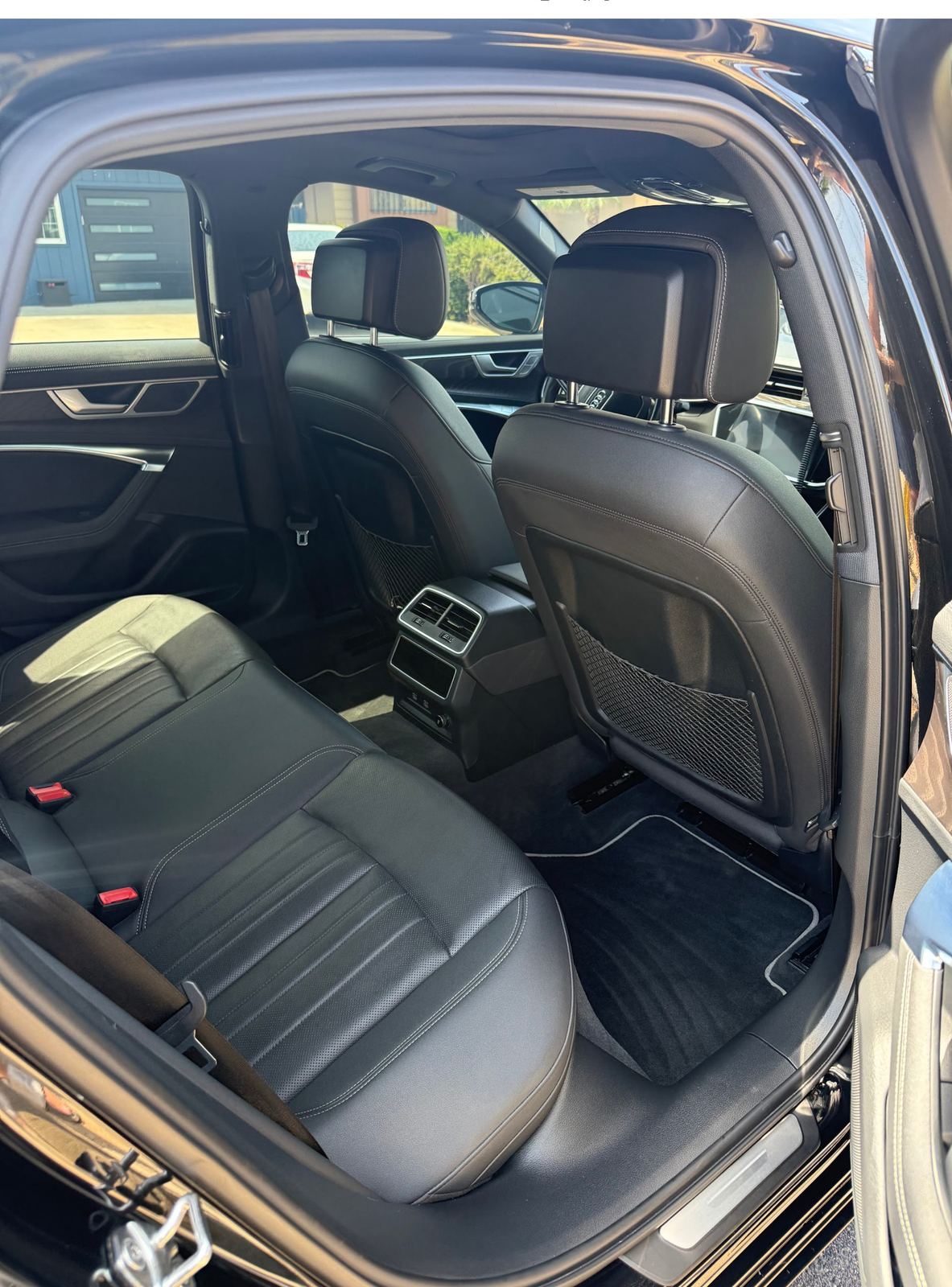 Detailed black Audi A6 rear leather interior, mobile detailing