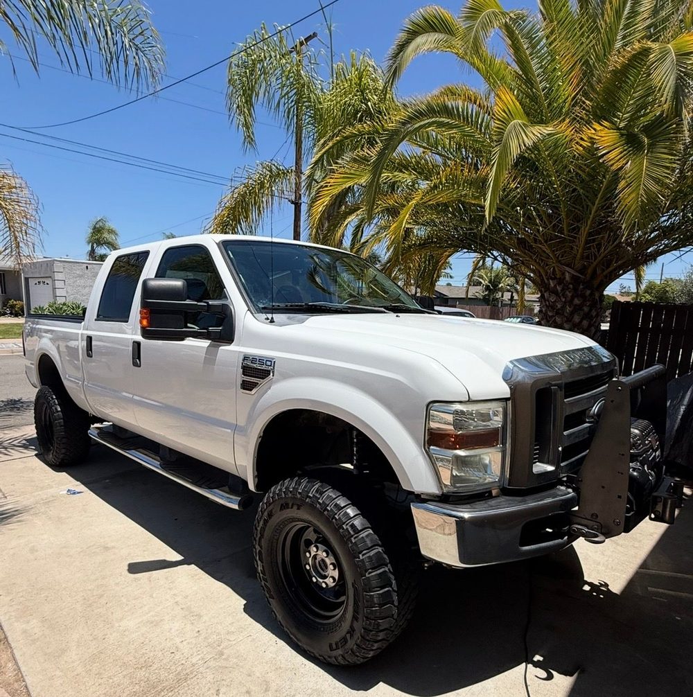 Detailed white lifted Ford F-250, mobile detailing