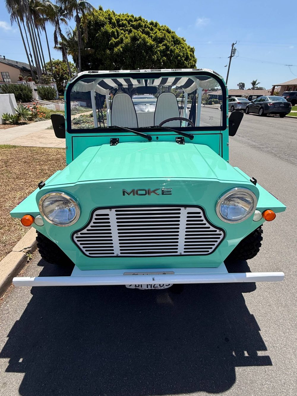 Detailed teal classic Mini Moke, mobile detailing