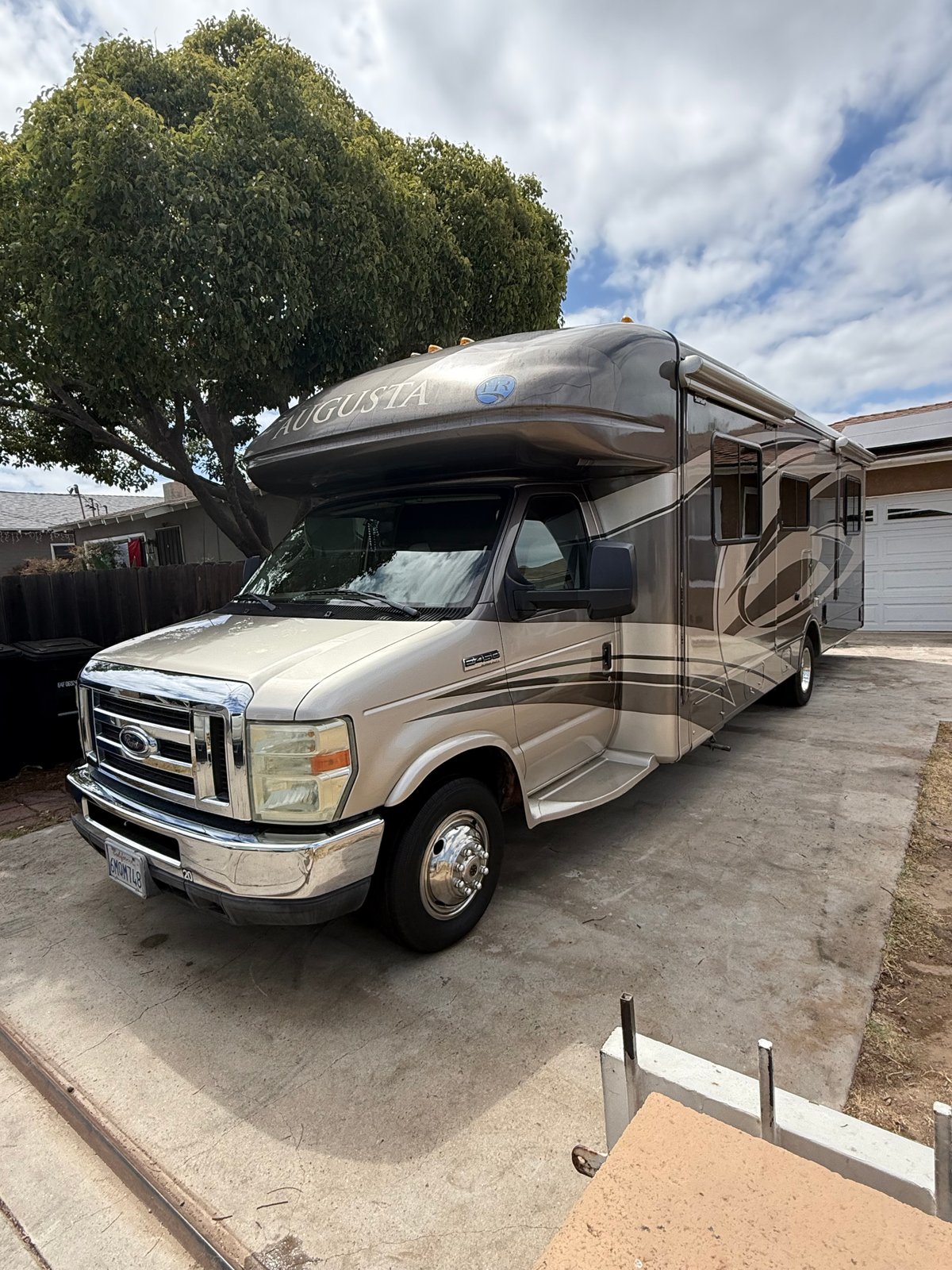 Augusta Class C motorhome after detailing — deep glossy shine