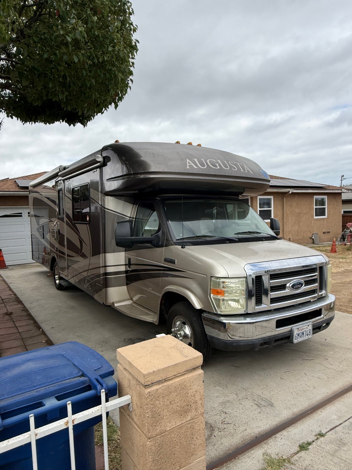 Augusta Class C motorhome before detailing — dull, faded exterior