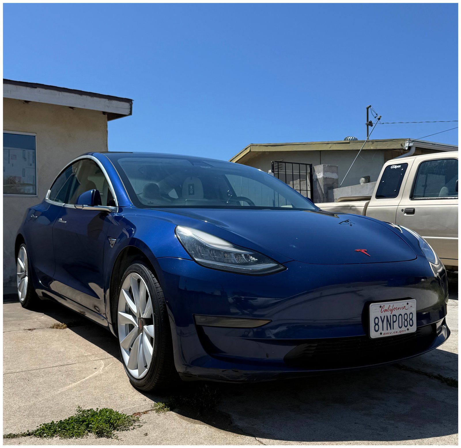 Detailed blue Tesla Model 3, mobile detailing